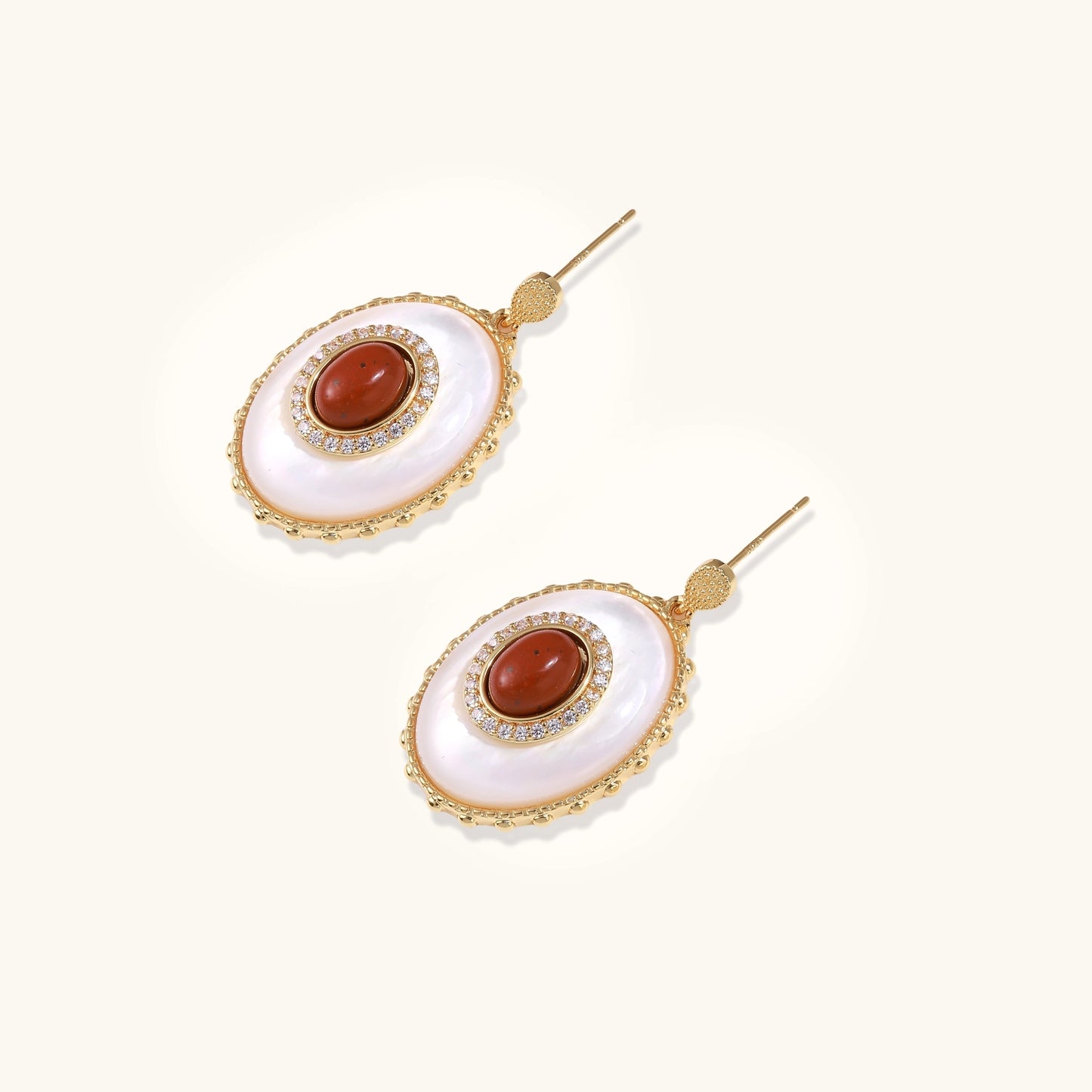 Gold-plated drop earrings with layered oval mother-of-pearl and cognac gemstone center framed by crystal halo