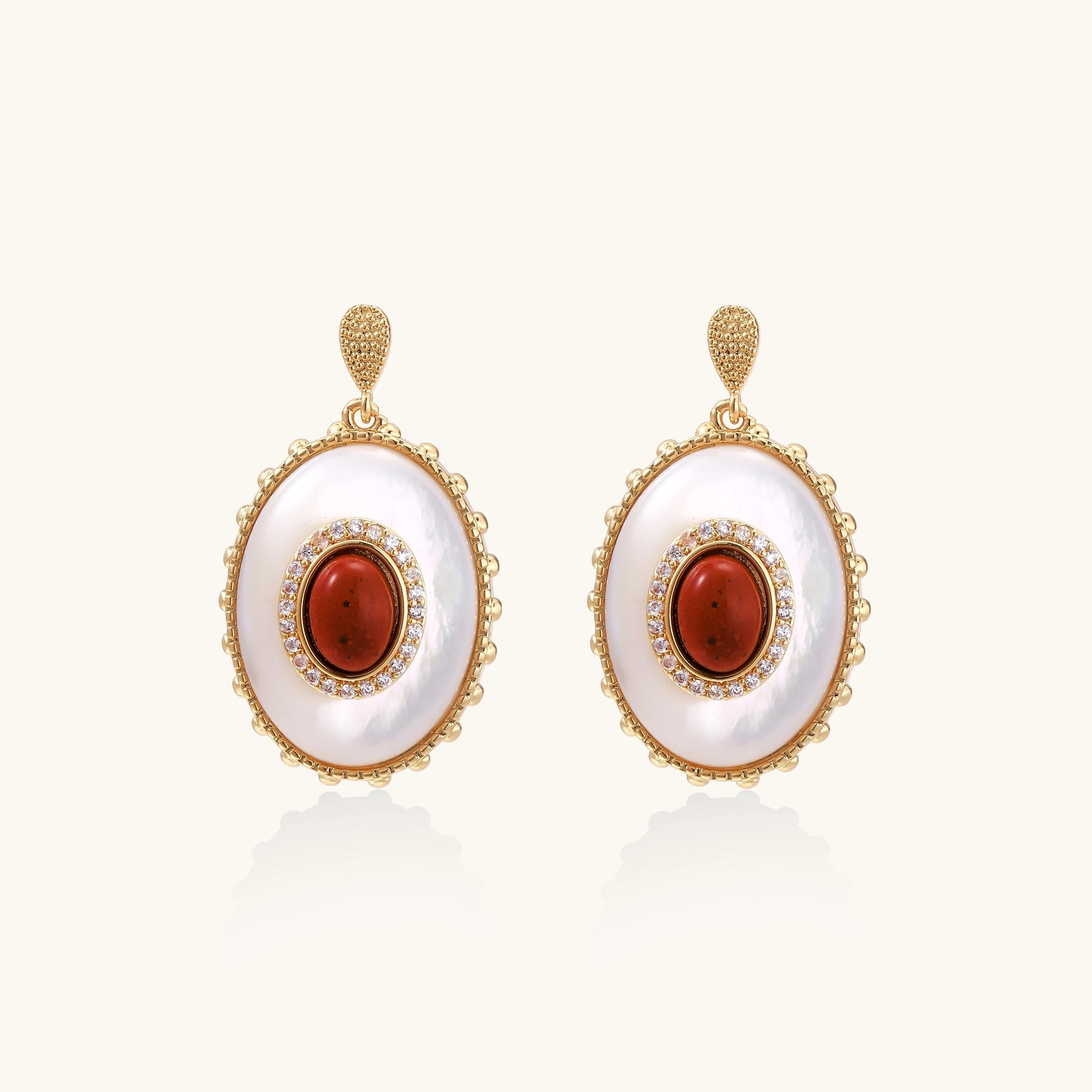 Gold-plated drop earrings with layered oval mother-of-pearl and cognac gemstone center framed by crystal halo