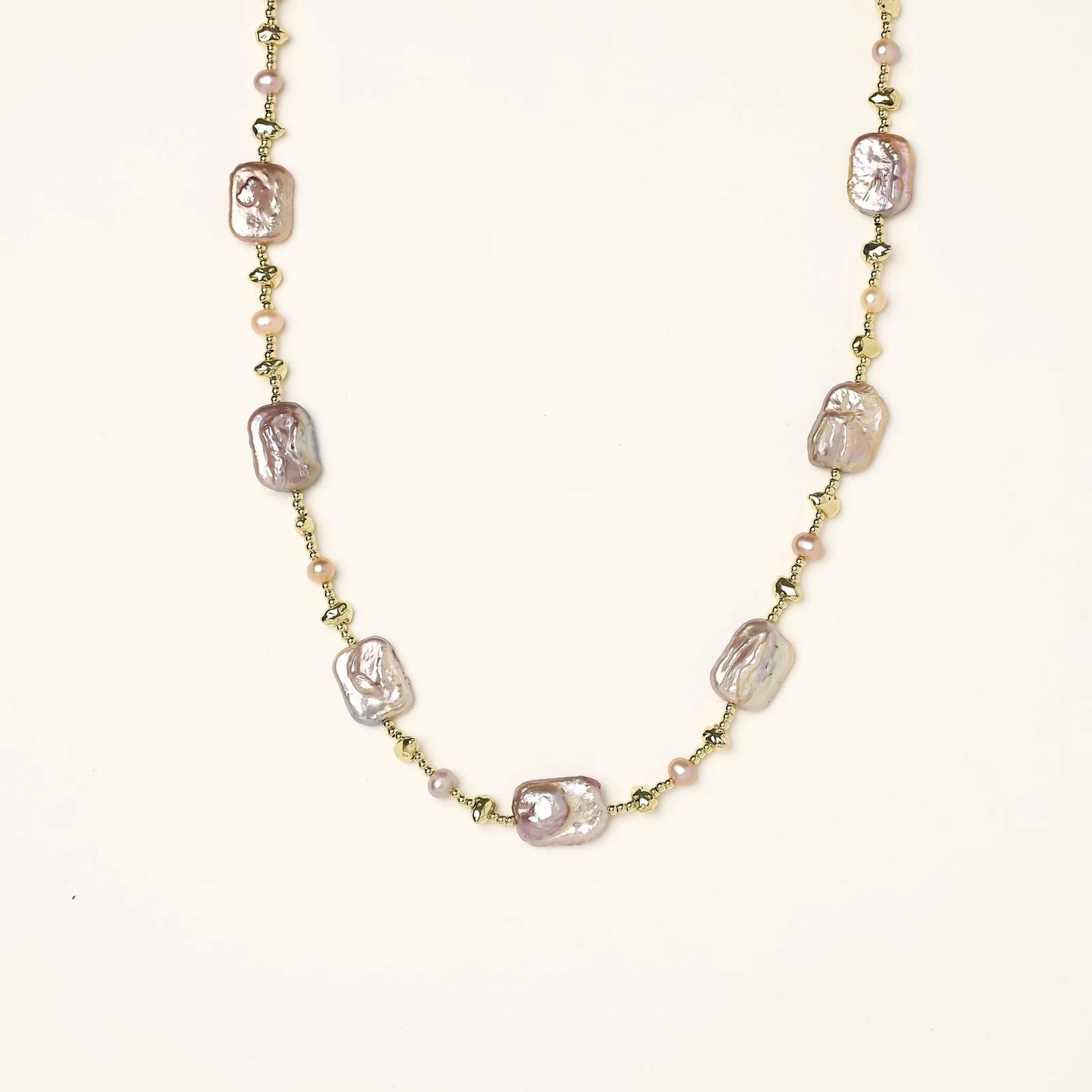 Iridescent baroque pearls alternating with small freshwater pearls on 14K gold-plated chain