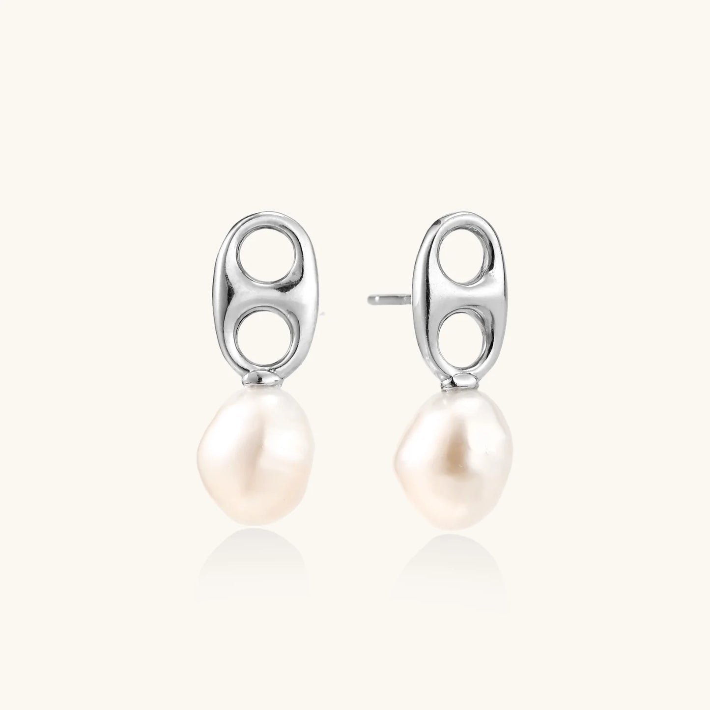 Modern rhodium-plated silver earrings with geometric double-circle design and freshwater pearl drops