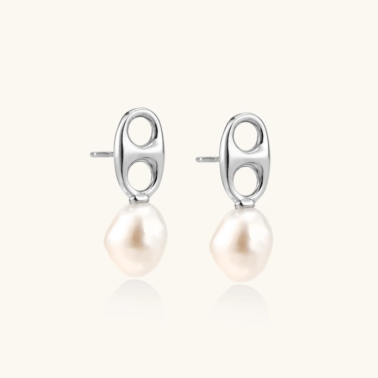Modern rhodium-plated silver earrings with geometric double-circle design and freshwater pearl drops