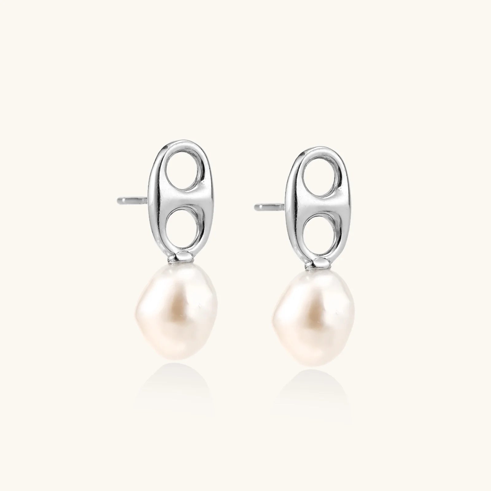 Modern rhodium-plated silver earrings with geometric double-circle design and freshwater pearl drops