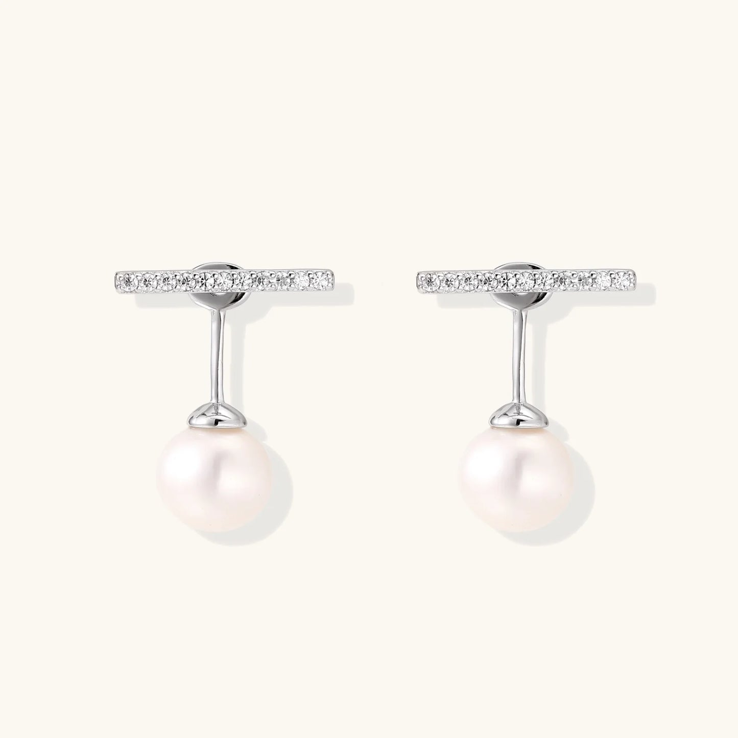 Rhodium-plated sterling silver ear jacket earrings with diamond-set horizontal bar and freshwater pearl drop