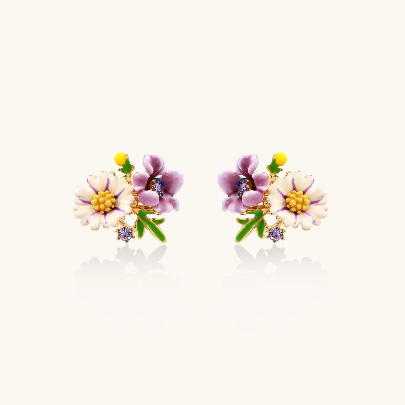 Cluster-style stud earrings with purple pansies, white daisies, yellow centers, and green leaves in glossy enamel finish