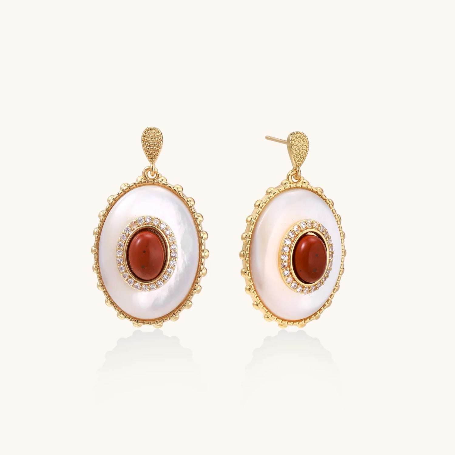 Gold-plated drop earrings with layered oval mother-of-pearl and cognac gemstone center framed by crystal halo